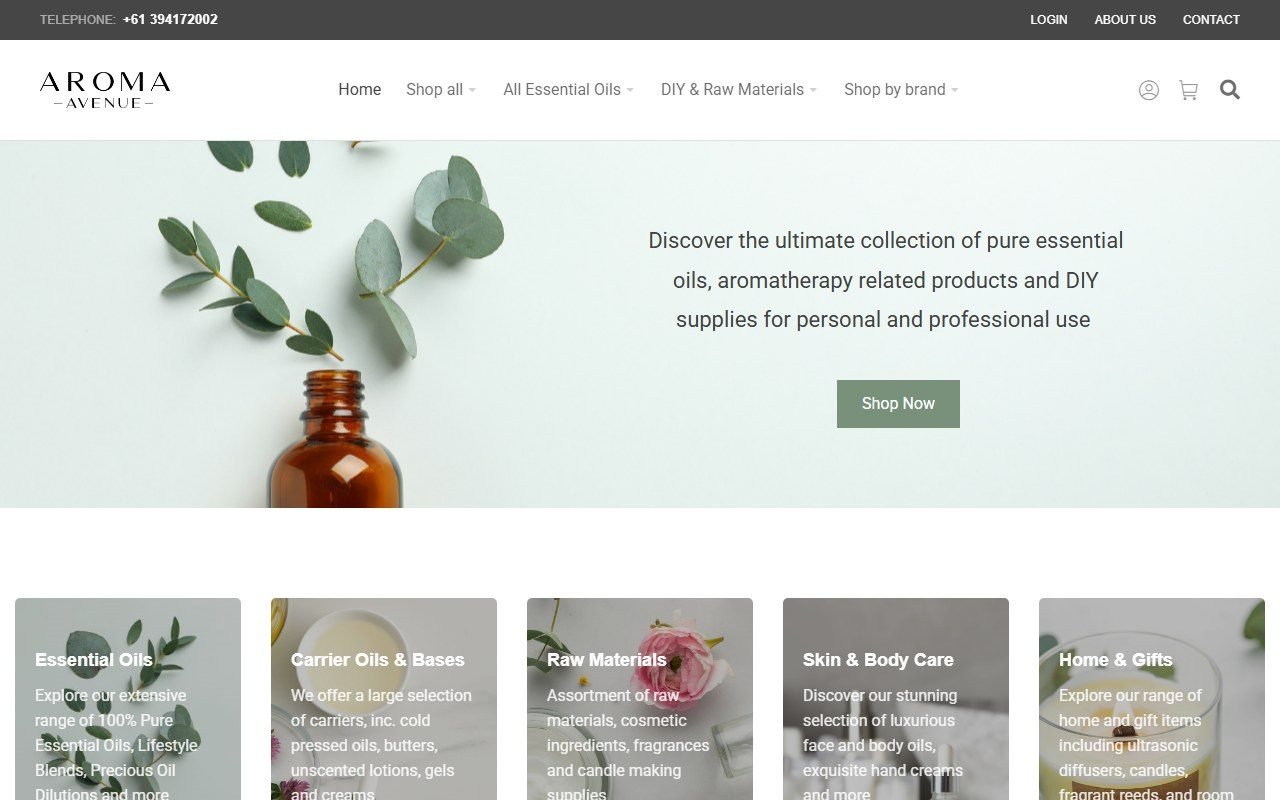 Aroma Avenue online store homepage, with an essential oil bottle and eucalyptus leaves